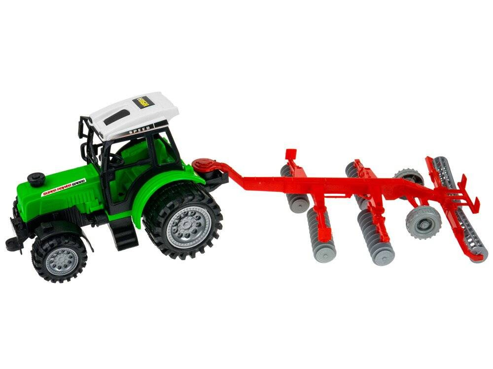 Traktor z ruchomą maszyną broną talerzową 